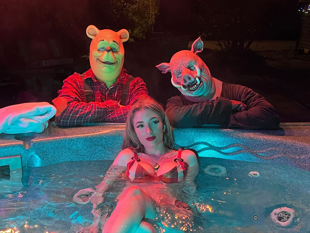 Natasha Tosini (Lara) poses with Winnie the Pooh and Piglet during filming